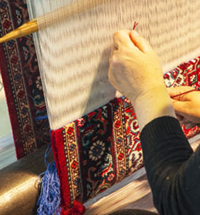 Hand weaving of traditional rugs